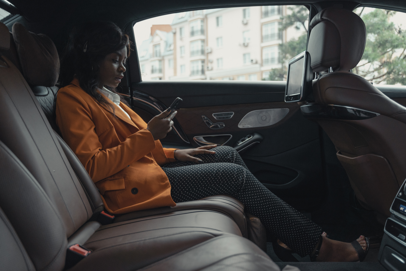 Passenger seated in a premium vehicle interior
