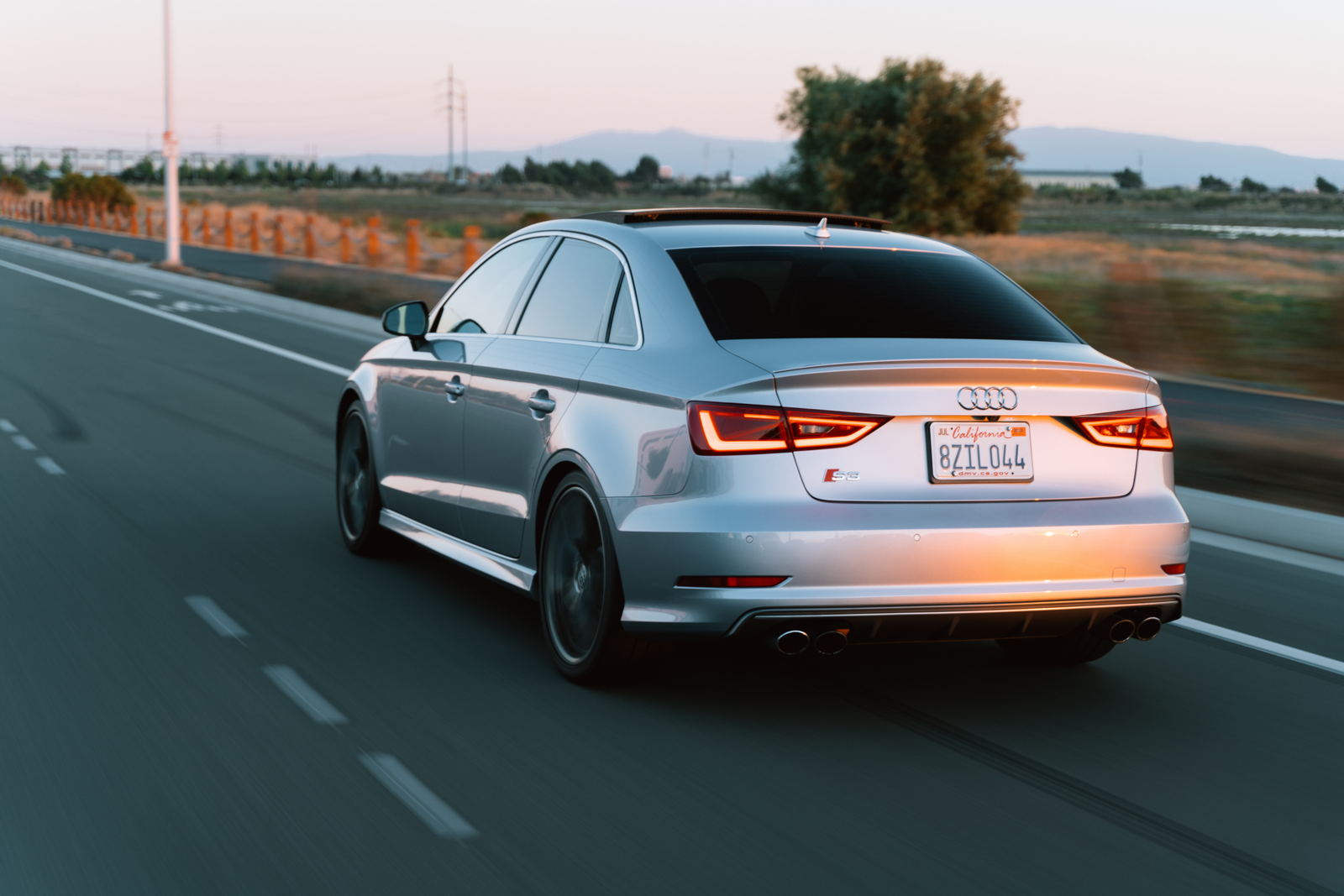 Premium vehicle on the road at golden hour